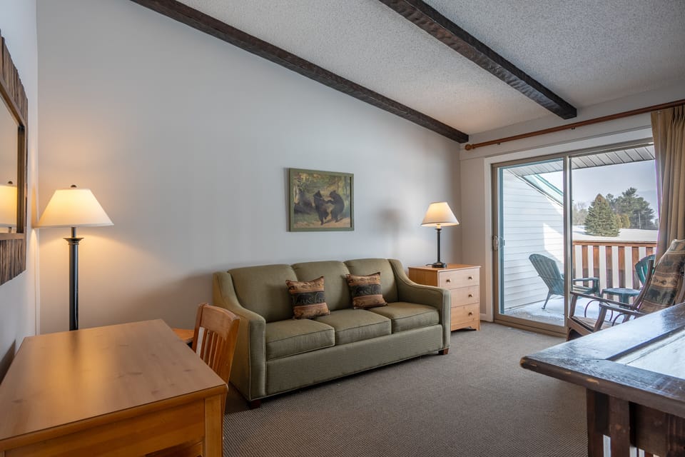 Queen memory foam mattress sleeper sofa in loft. Also private deck area