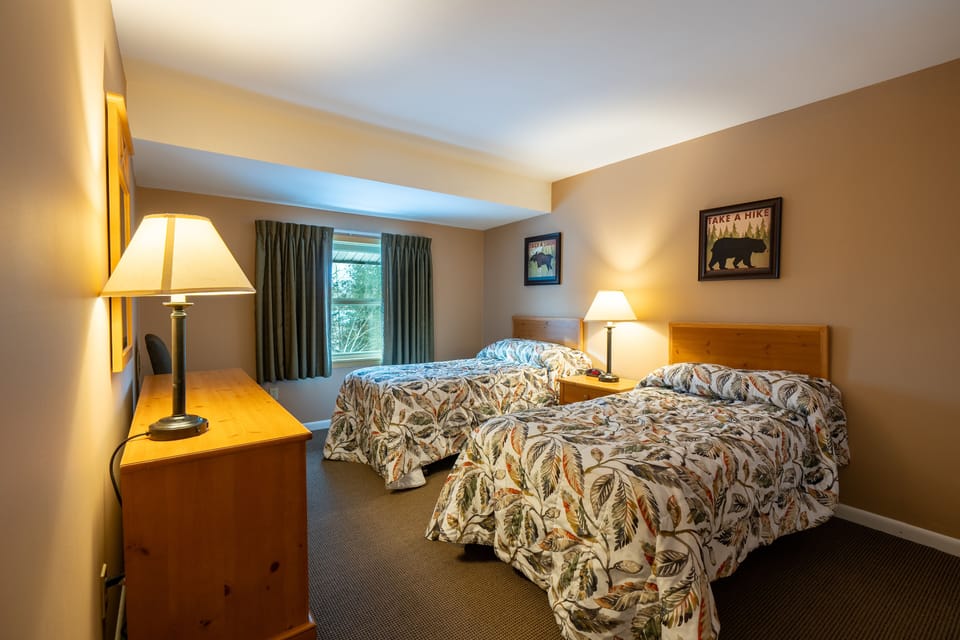2 twin size beds in second bedroom