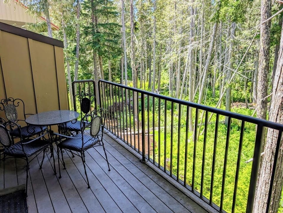 Private balcony with a table, 4 chairs, and BBQ grill