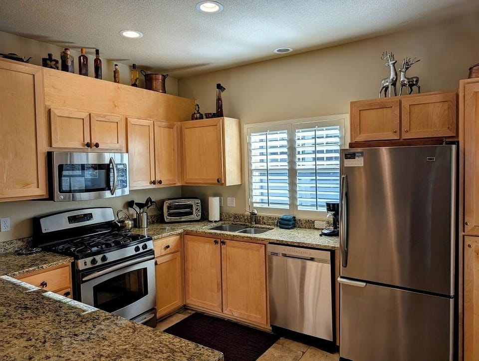 Fully equipped kitchen with stainless steel appliances