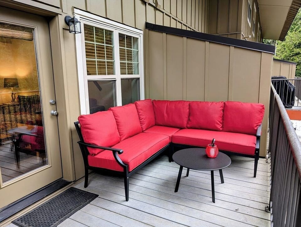 Large sofa on the private balcony facing the Mt. Hood National Forest