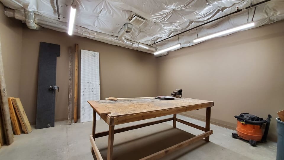 Generously Sized Work Area for Gear Maintenance, Located in Garage