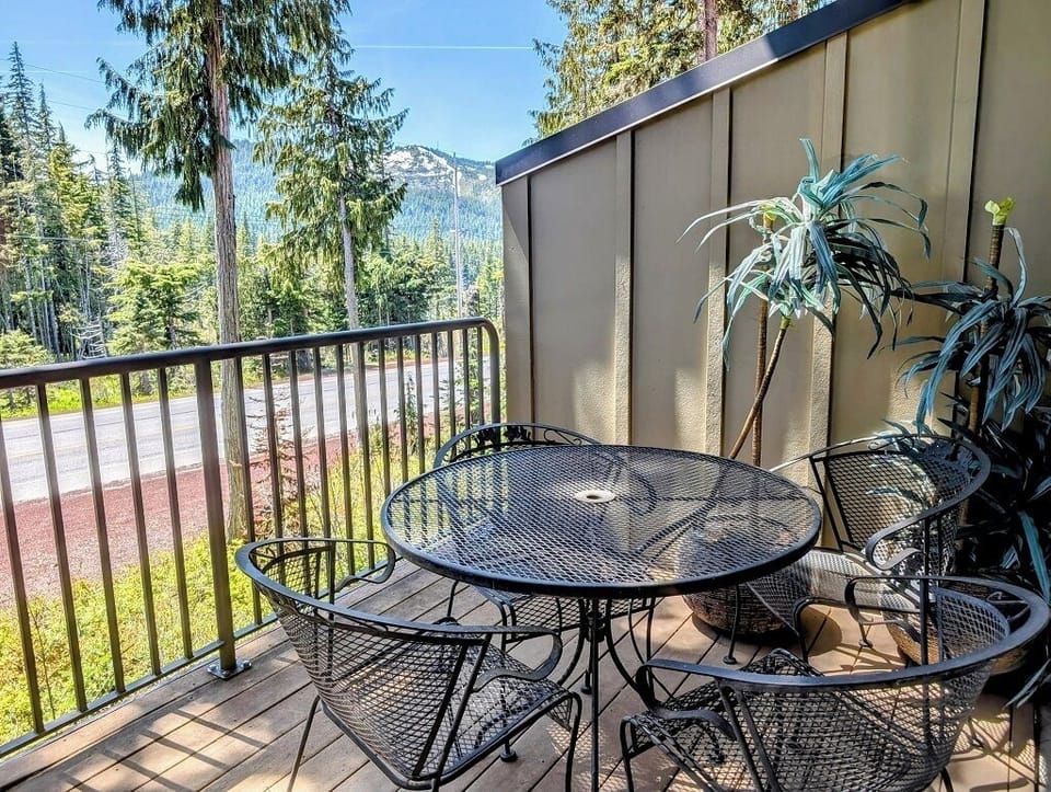 Table and chairs on the private balcony with views of Mt. Hood Skibowl