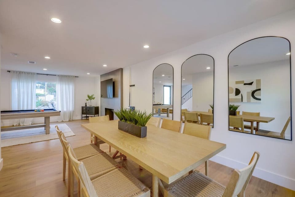 Dining room w/ arched accents and natural light, adding character and warmth.