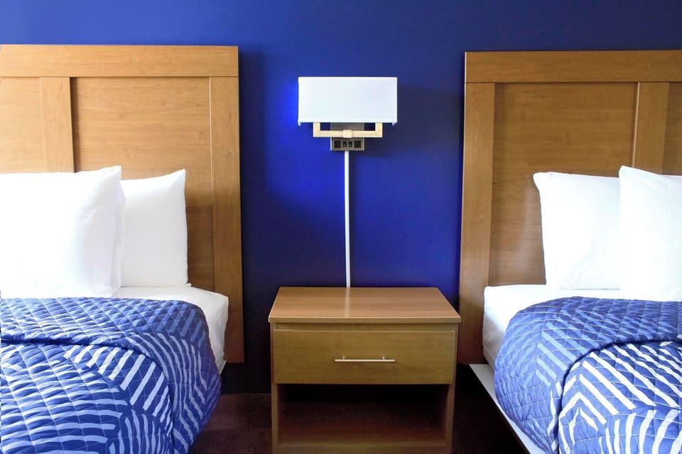 Basic Room, 2 Double Beds, Non-Smoking, Exterior Entry | Hypo-allergenic bedding available, laptop workspace, WiFi (free)