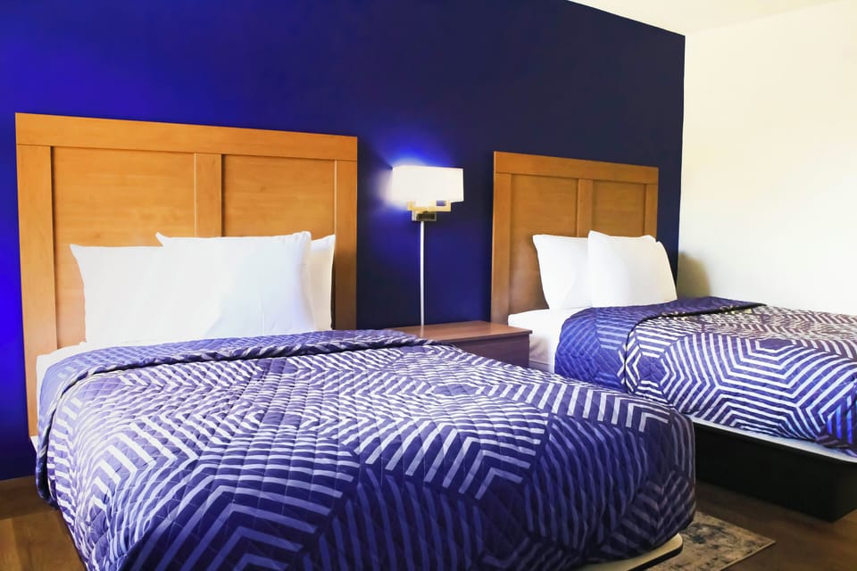 Basic Room, 2 Double Beds, Non-Smoking, Exterior Entry | Hypo-allergenic bedding available, laptop workspace, WiFi (free)