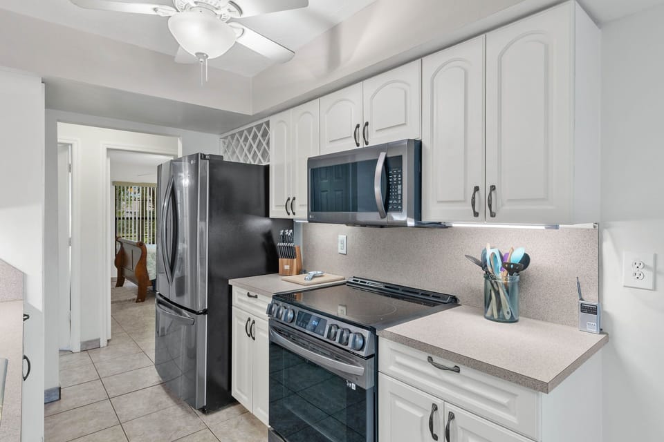 The kitchen is fully equipped & has stainless steel appliances