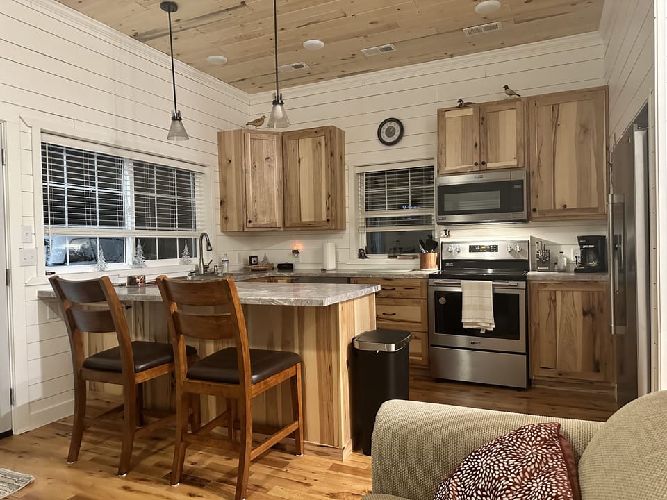 Custom Hickory Kitchen with stainless steel appliances. 