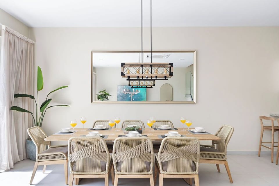 Dine in elegance at our inviting space, featuring a dining table with seating for 8 - the perfect setting for creating lasting memories over delicious meals.