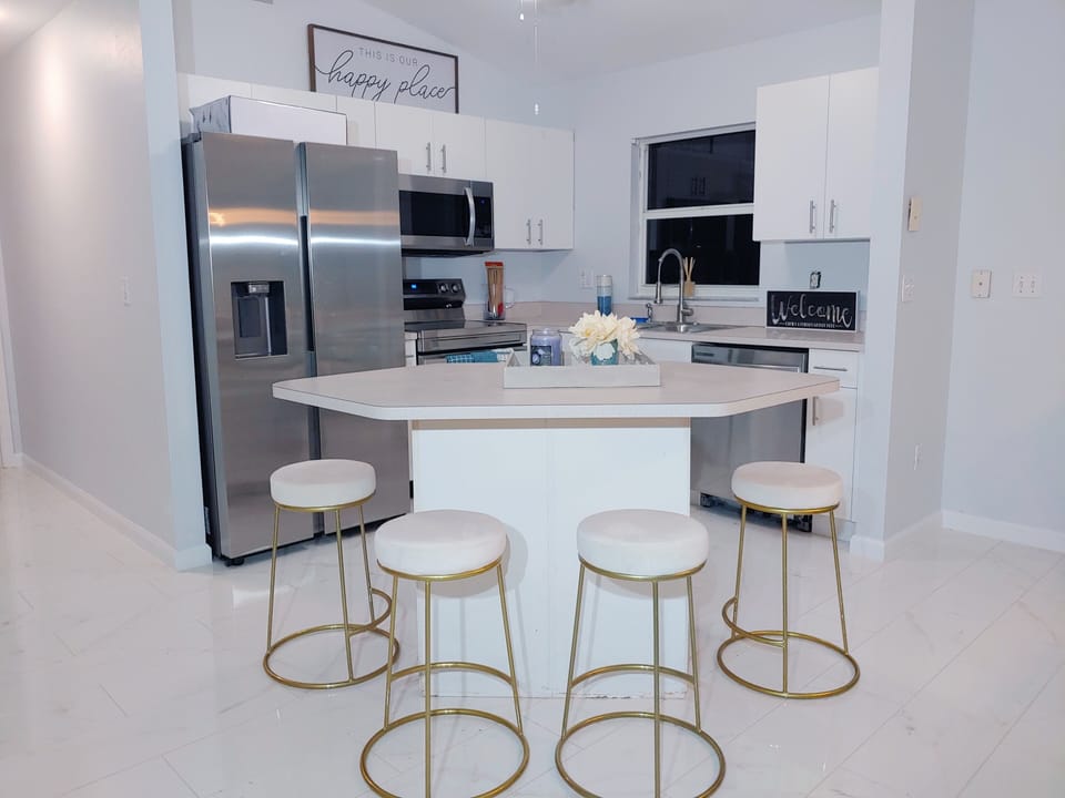 Kitchen Area and Bar Sitting Area