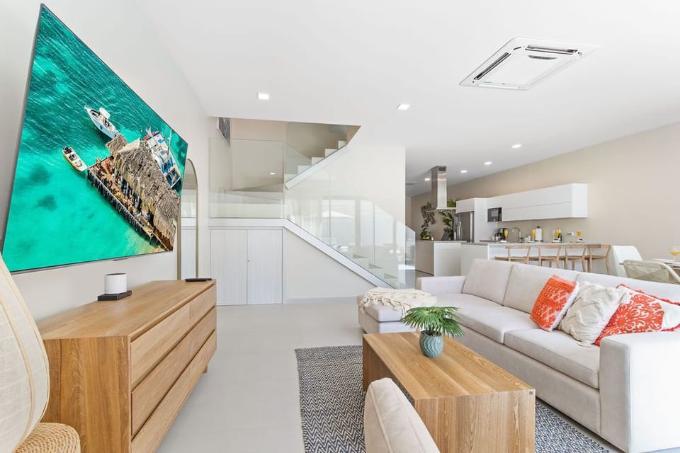 A symphony of comfort and modern aesthetics – our living area invites you to relax and enjoy the best in relaxation. Comfy sofa, top-notch TV, and contemporary flair at its finest.