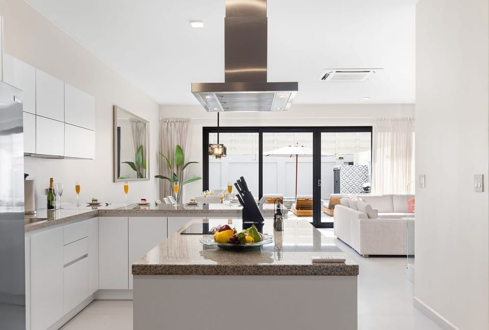 Step into the future of cooking with our state-of-the-art kitchen, featuring sleek stainless-steel appliances and contemporary conveniences. Elevate your culinary experience.