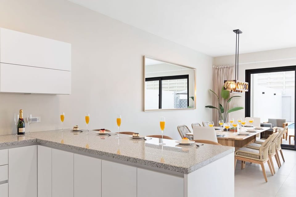 Culinary dreams come to life in our fully equipped kitchen, where cutting-edge stainless-steel appliances meet modern convenience. Your gourmet haven awaits.