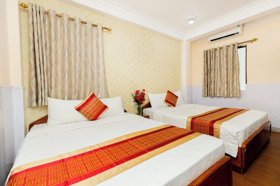 Family Room, City View | Minibar, desk, free WiFi, bed sheets