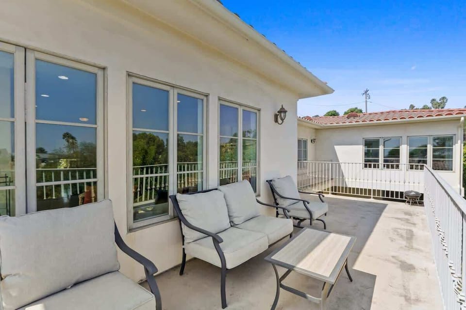 Step onto the upper balcony for breathtaking views. On clear days, enjoy glimpses of downtown LA, perfect for morning coffee or evening stargazing. This private retreat offers a serene space to relax and take in the city's beauty.