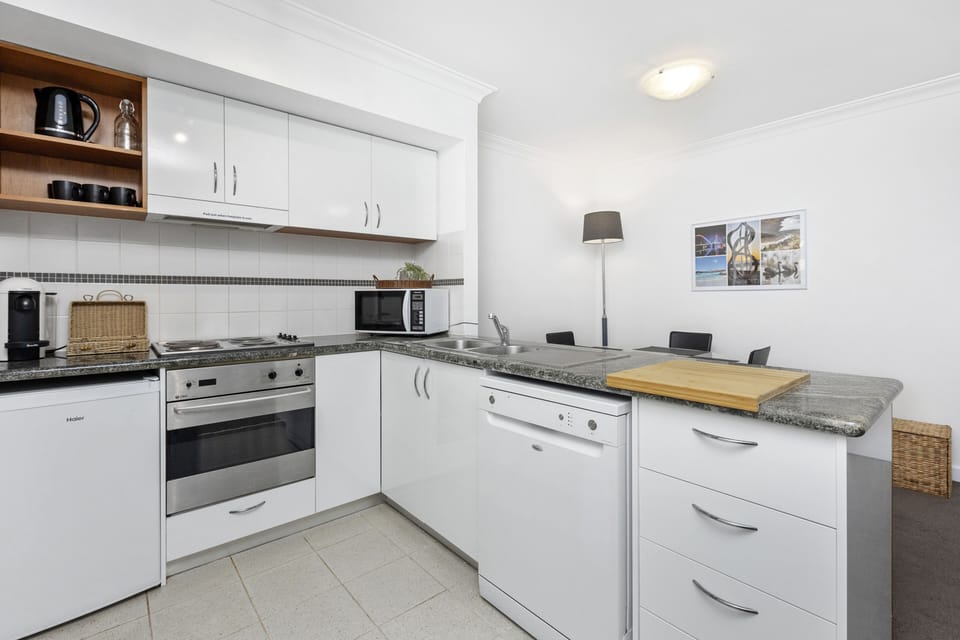 The spacious kitchen provides ample counter space and modern appliances, making meal preparation a breeze.