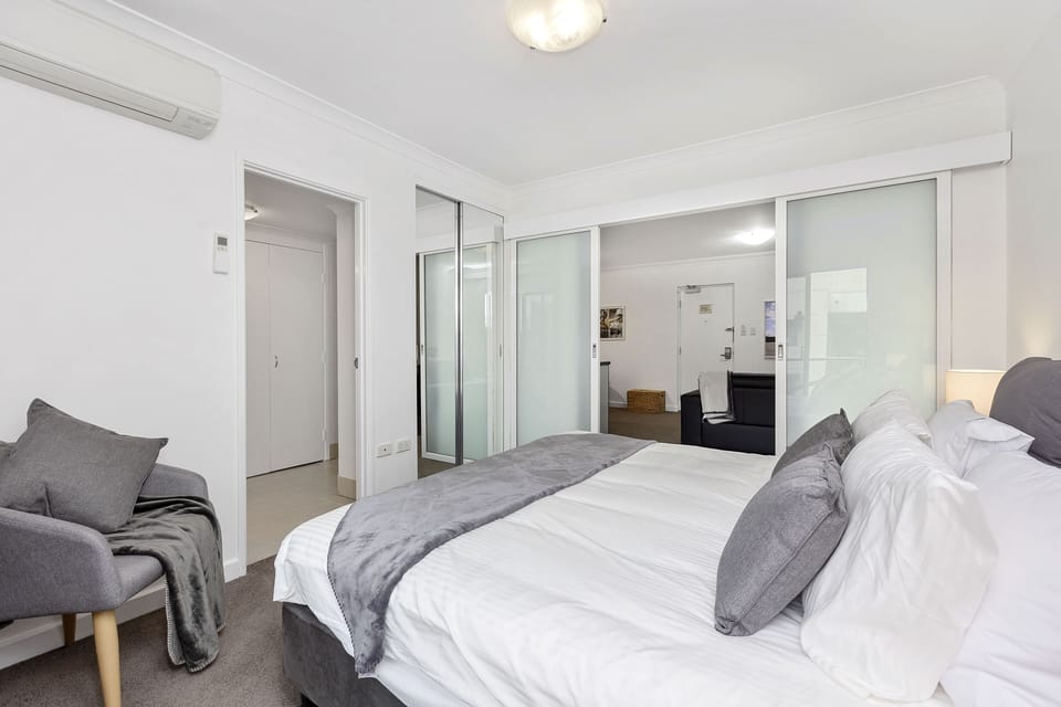 Retreat to this inviting bedroom, complete with a comfortable bed.