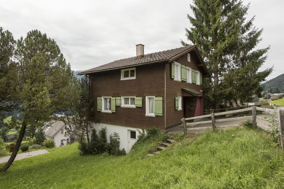 Rustic holiday home with green shutters