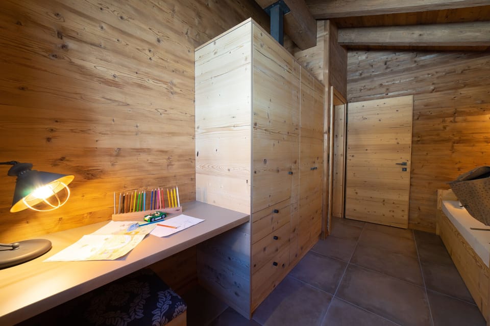 Bedroom with desk and colouring supplies