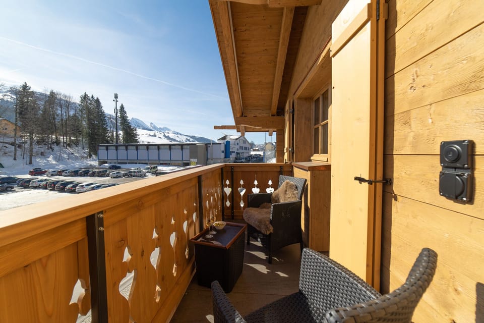 Balcony seating with views of the snowy mountains