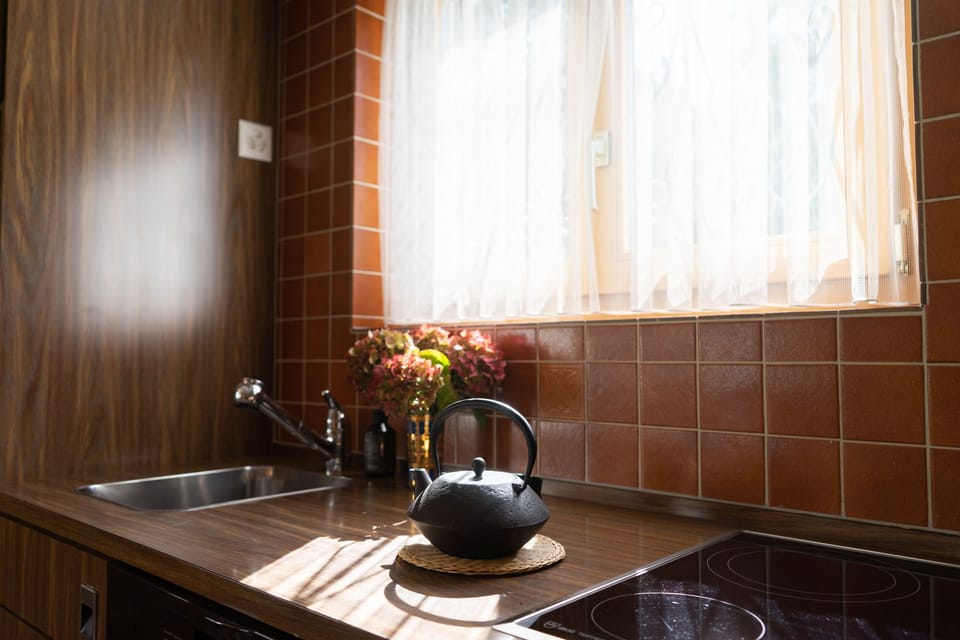 Kitchen counter with teapot and sunny window