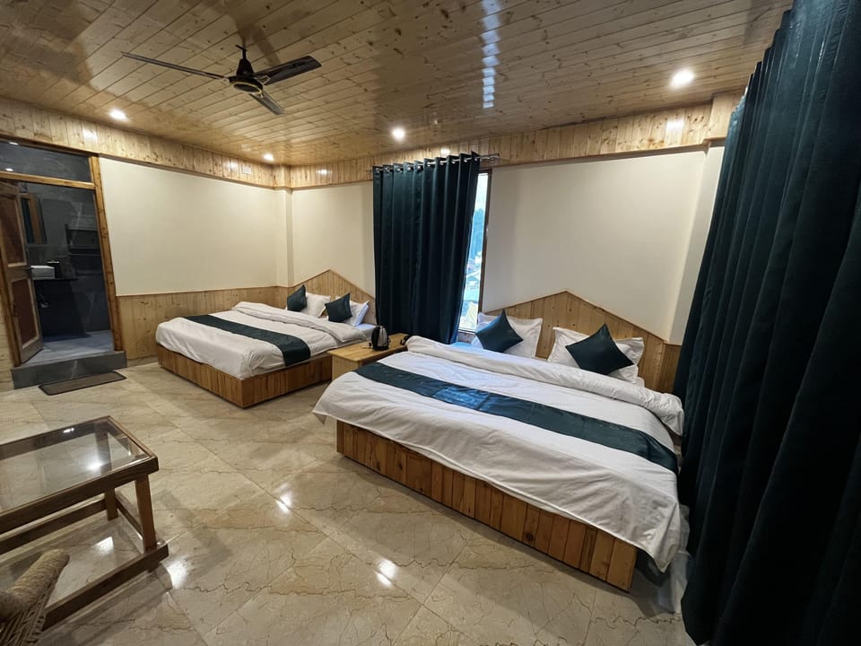 Family Room, 2 Double Beds, Mountain View | Free WiFi, bed sheets