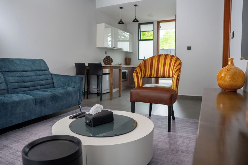 Comfort Double Room, 2 Queen Beds, Pool View | Living area | 45-inch Smart TV with satellite channels, Netflix, streaming services