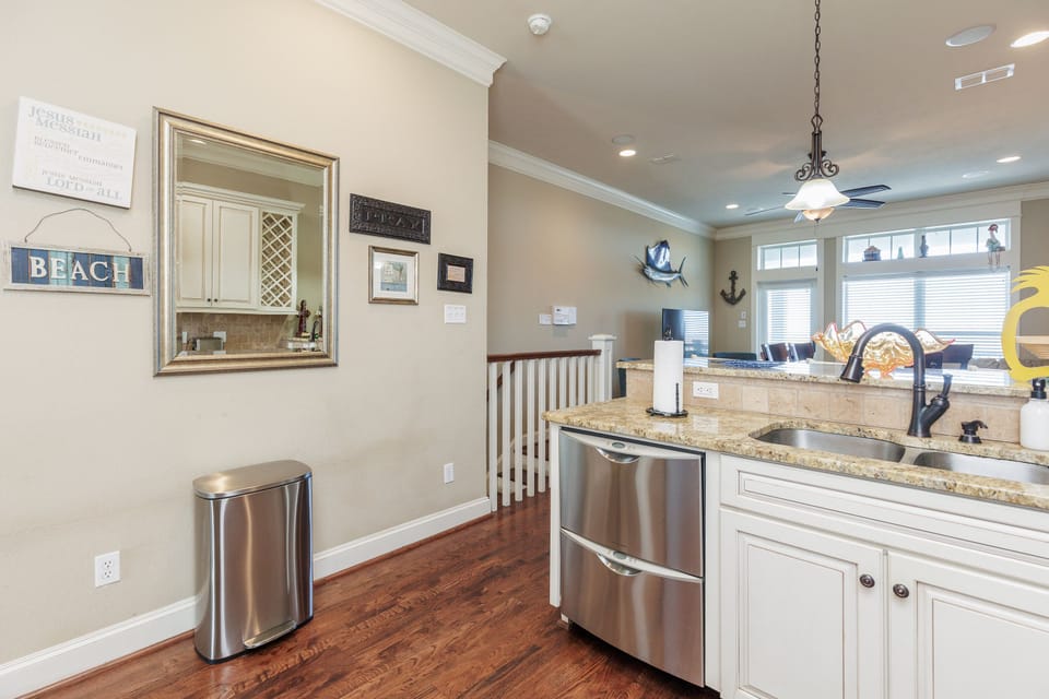 Your open kitchen creates the perfect space for cooking together, with granite counters and coastal charm throughout.