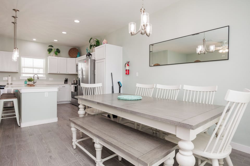 Gather your family around this spacious dining table, perfectly positioned next to the bright, fully-equipped kitchen for memorable meals together.
