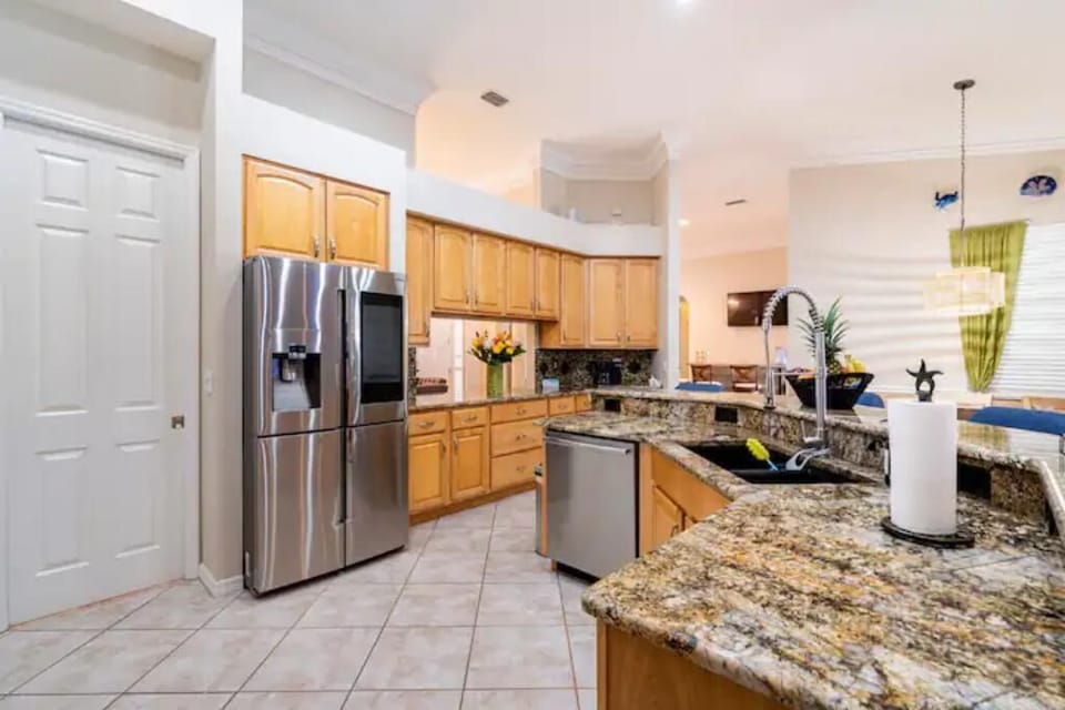 Complete kitchen with large island and spacious counter.