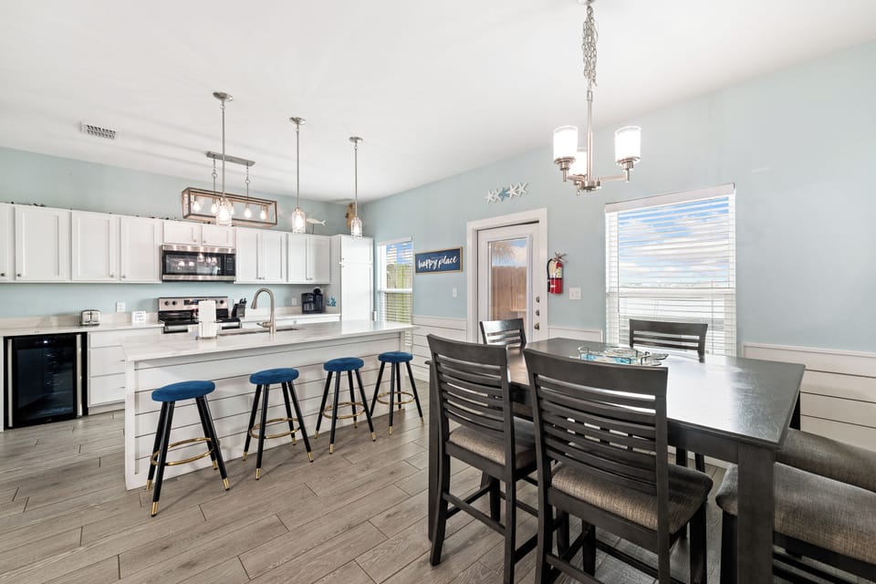 Gather around the island for morning coffee or share a home-cooked meal at the dining table—this bright, open kitchen invites you to relax and make memories together.