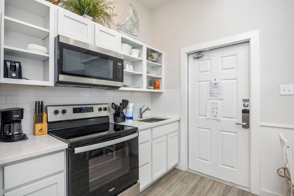Your bright, fully-equipped kitchen awaits with modern appliances and everything you need to create memorable meals together.