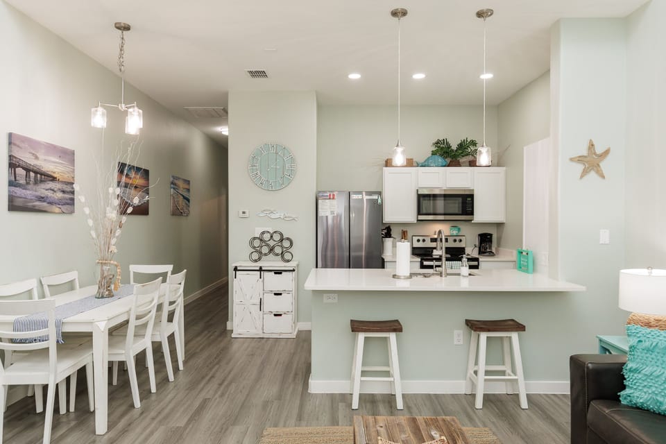 Your bright, open-concept kitchen flows seamlessly into the dining area, perfect for preparing meals and gathering together.