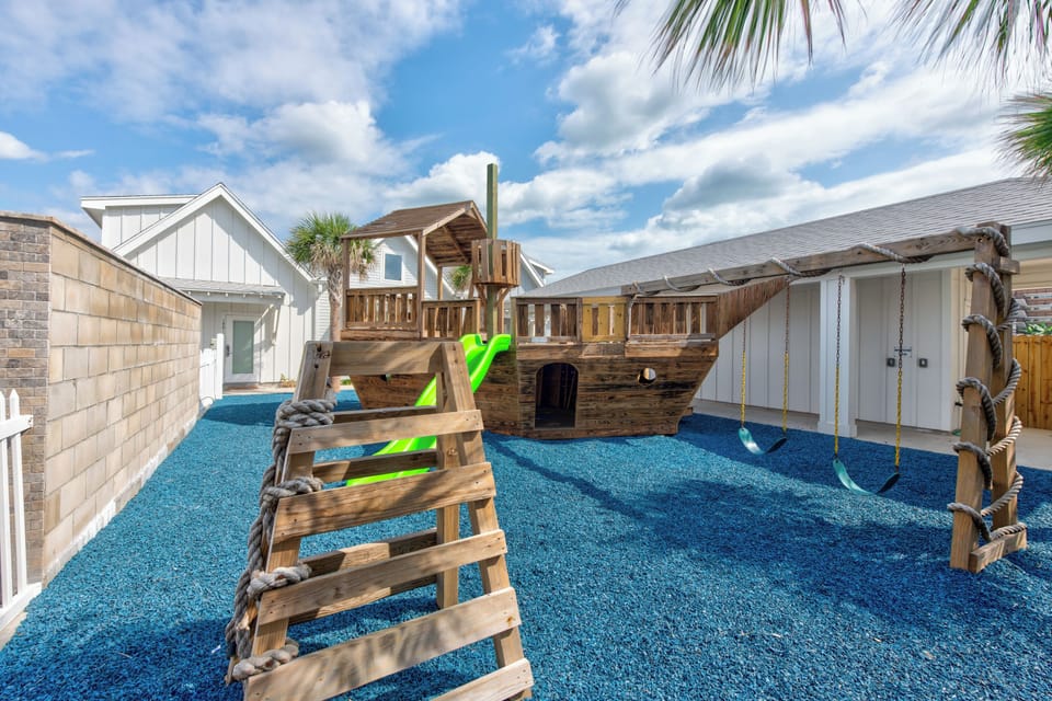 Adventure awaits in your private pirate ship playground! Kids will love exploring the fort, swings, and slides on soft blue surfacing.