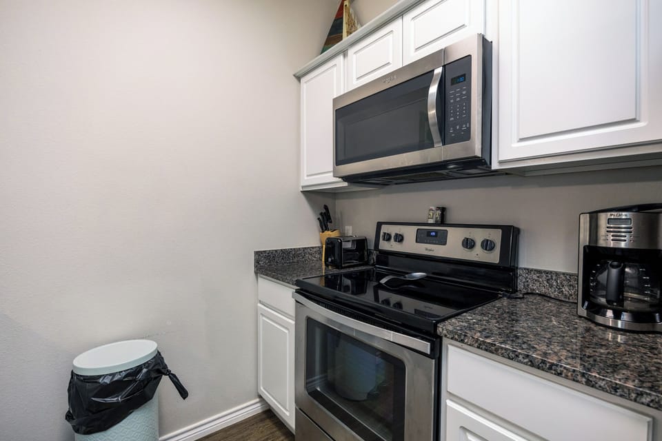 Your fully equipped kitchen features granite countertops, stainless steel appliances, and everything you need to create delicious meals during your stay.