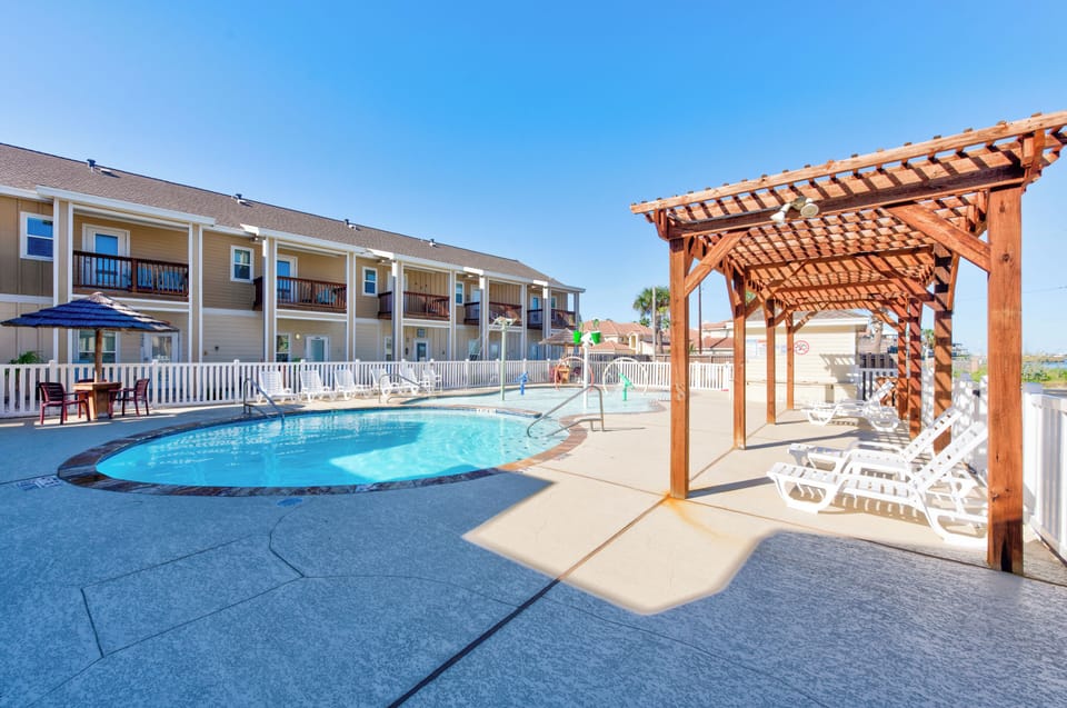 Take a refreshing dip in your sparkling pool, then unwind under the shaded pergola with stunning views of the property.
