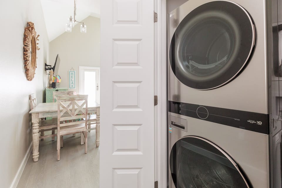 Your own stackable washer and dryer make packing light a breeze, while the charming dining nook awaits your morning coffee rituals.