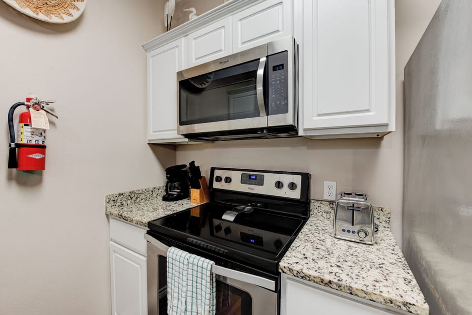 Your fully equipped kitchen features granite countertops, stainless steel appliances, and everything you need for home-cooked meals during your stay.