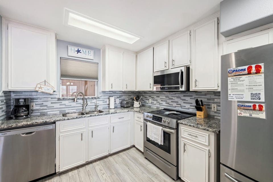 Your fully equipped kitchen features granite counters, stainless appliances, and everything you need to prepare meals together during your stay.