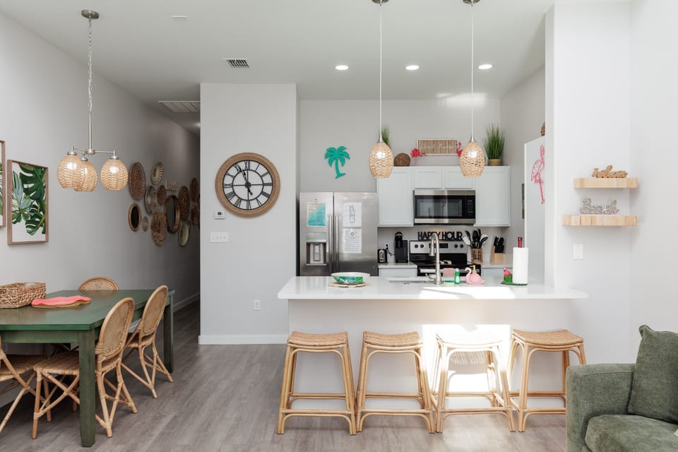 Your open-concept kitchen features modern appliances and a breakfast bar where you can gather with loved ones over morning coffee.