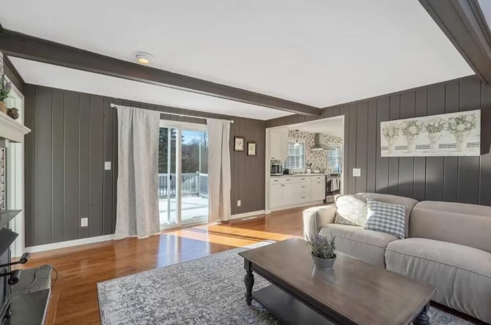Experience comfort and style in our spacious, sunlit living room.