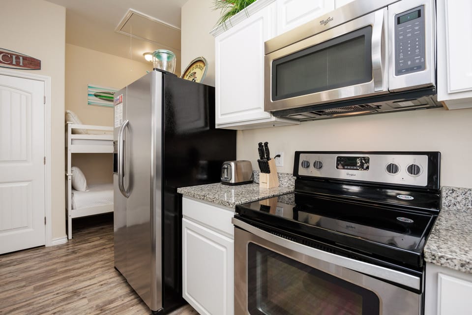 Your fully-equipped kitchen features granite countertops, stainless steel appliances, and everything you need to create memorable meals during your stay.