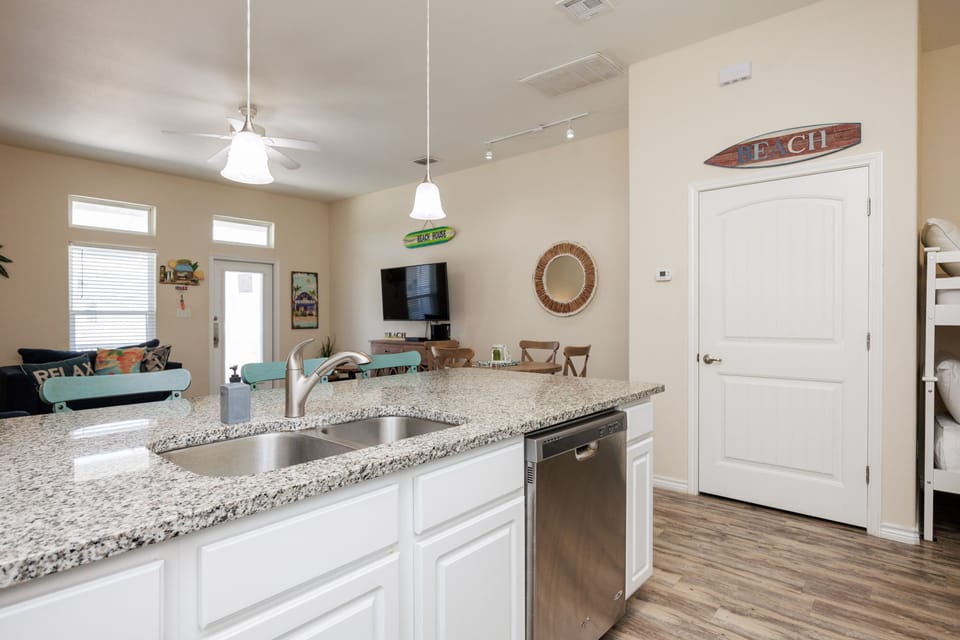 Your open kitchen flows seamlessly into the living space, perfect for preparing meals while staying connected with family and friends.