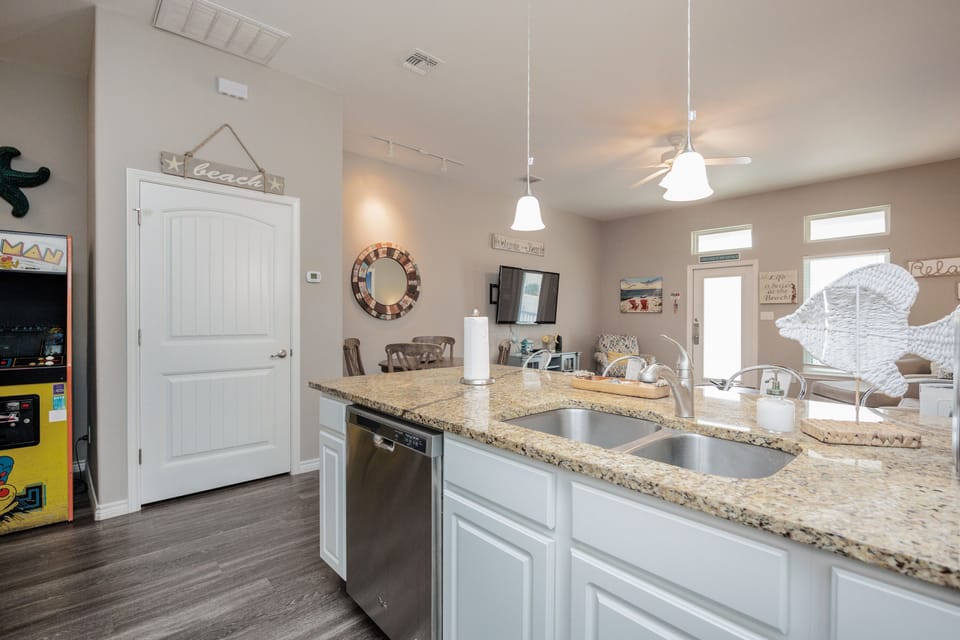 Your open kitchen features granite countertops, stainless appliances, and flows seamlessly into the cozy living area—perfect for gathering.