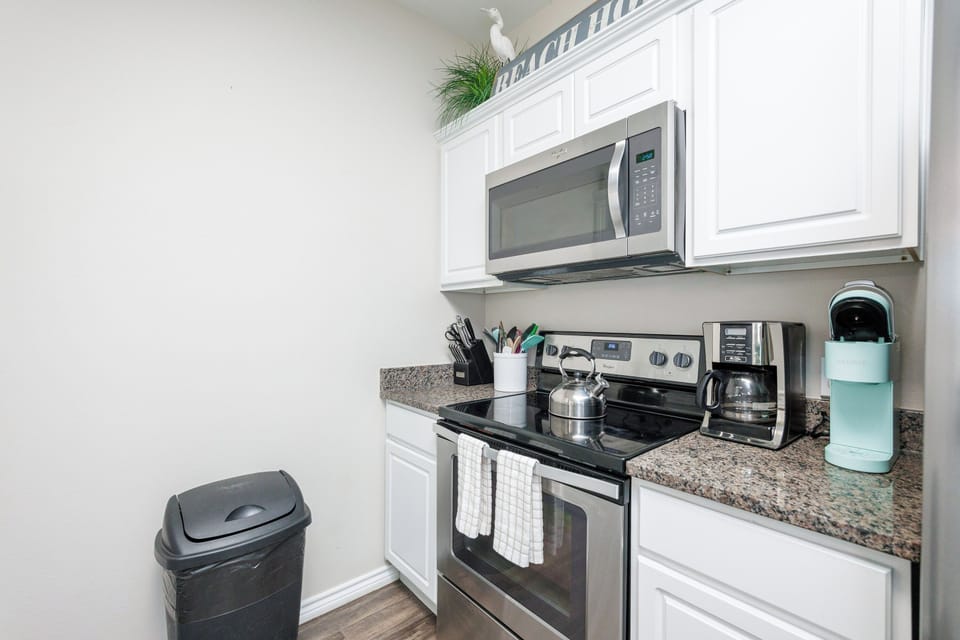 Your fully equipped kitchen awaits with granite counters, stainless appliances, and everything you need to create memorable meals during your stay.