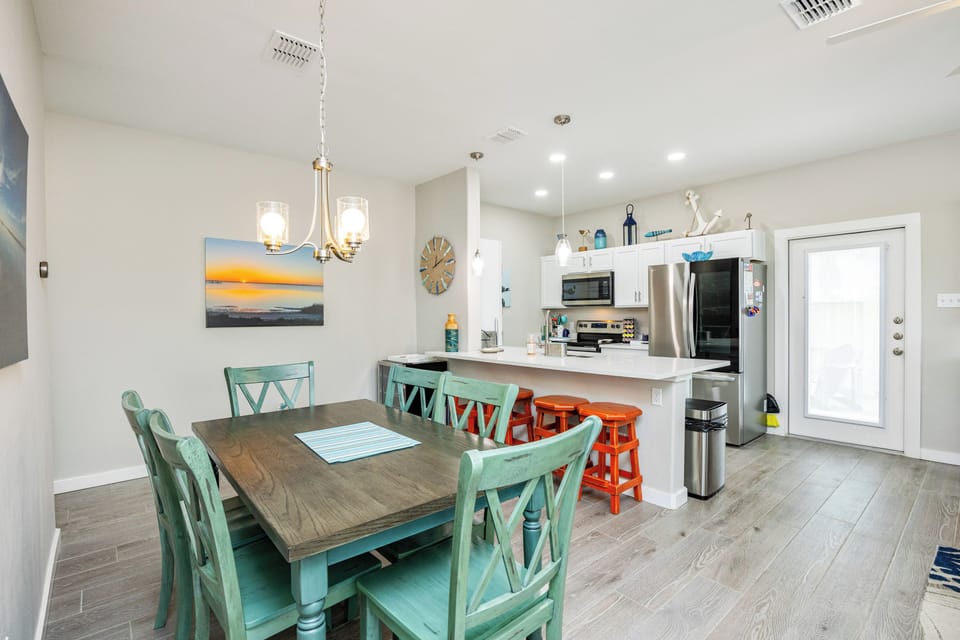 Your spacious kitchen and dining area combines coastal charm with modern convenience for memorable family meals together.