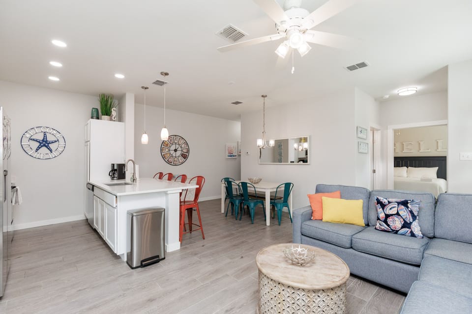 Your bright, open living space flows seamlessly from kitchen to dining to lounge, creating the perfect gathering spot for relaxation.