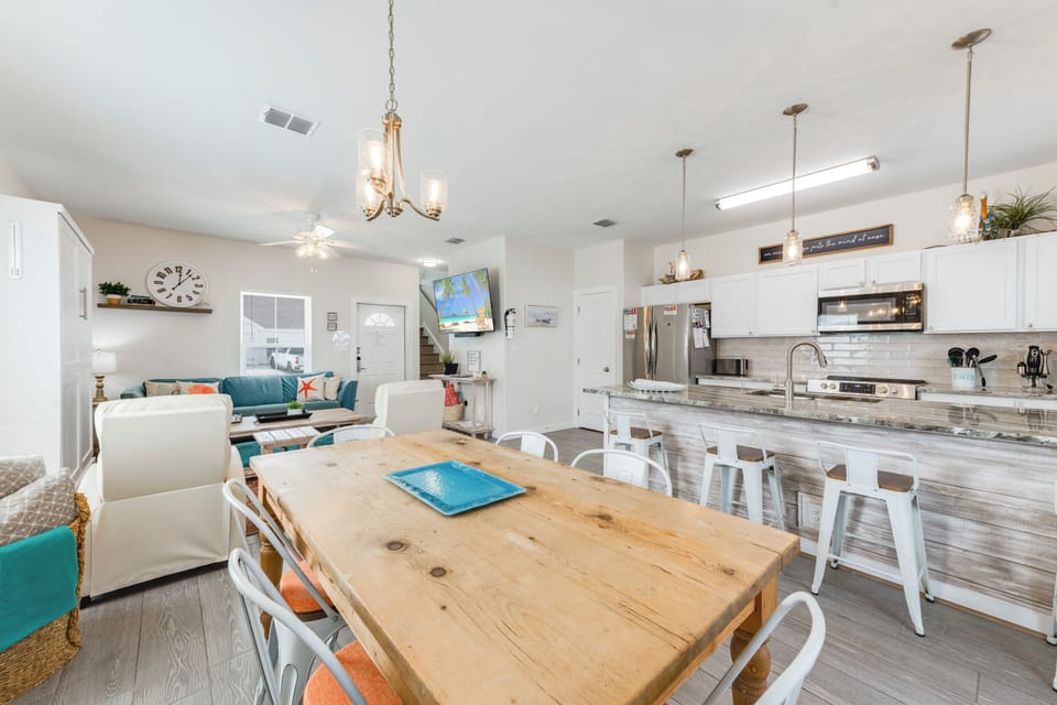 Your open-concept space flows seamlessly from dining to kitchen to living area, perfect for gathering with loved ones.