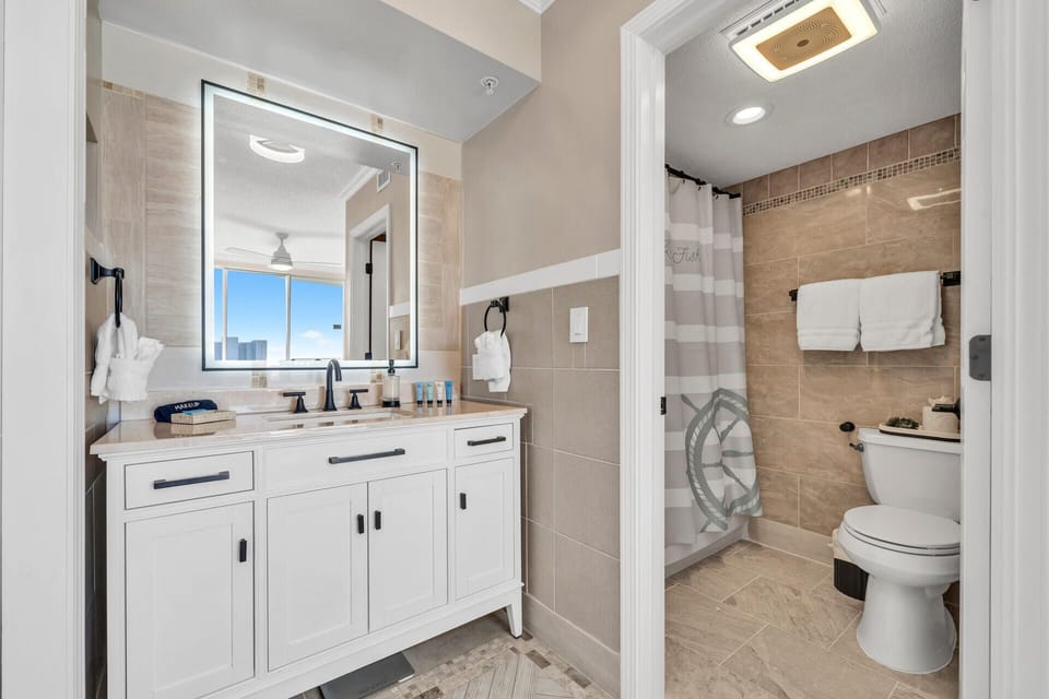 Refresh in your spacious bathroom with modern vanity, walk-in shower, and thoughtful amenities.