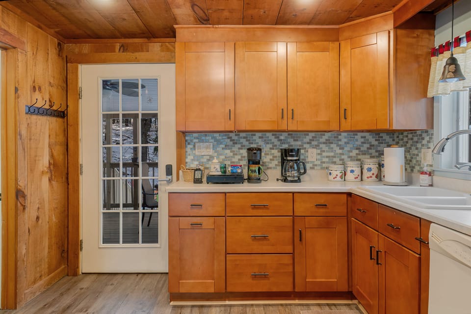 Kitchen looking out to the screened porch.
